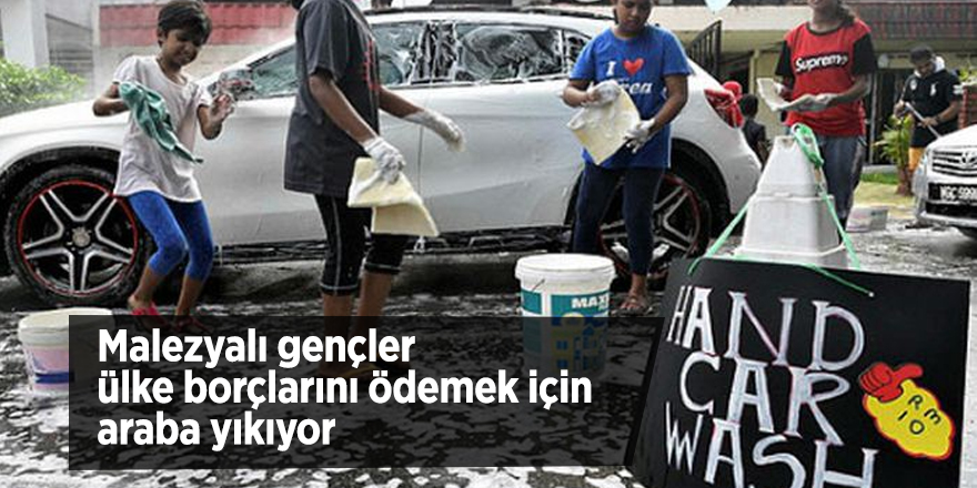 Malezyalı gençler ülke borçlarını ödemek için araba yıkıyor