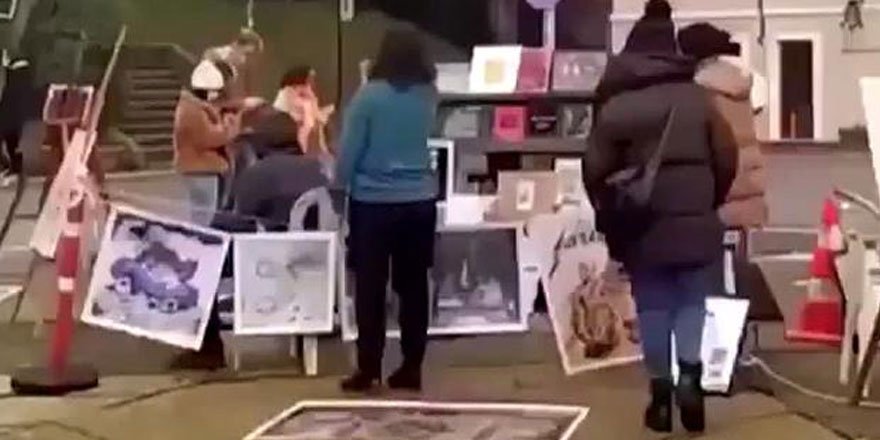 Kabe fotoğrafını yere seren 2 kişi tutuklandı